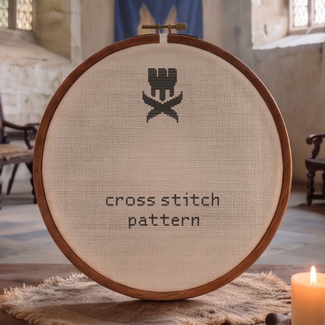 An embroidery hoop with the Crossed Realms logo